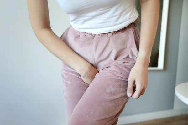 woman running for the toilet because of urinary incontinence Hampshire